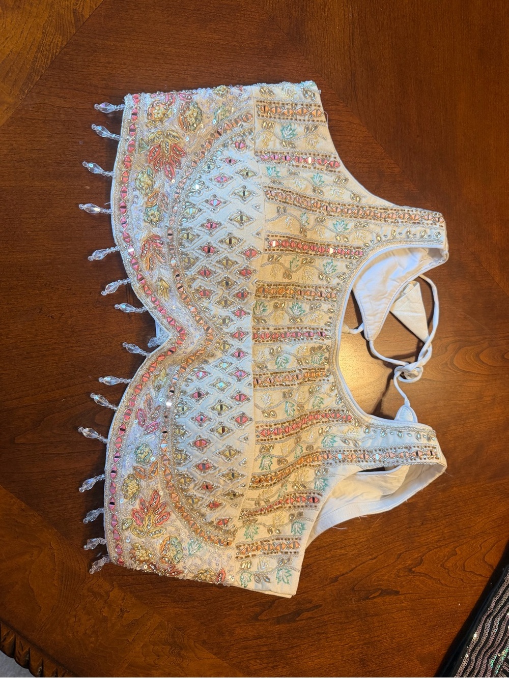 Embellished White Beaded lehenga blouse with  Pastel Accents